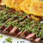 Grilled Flank Steak topped with Chimichurri alongside fried Tostones