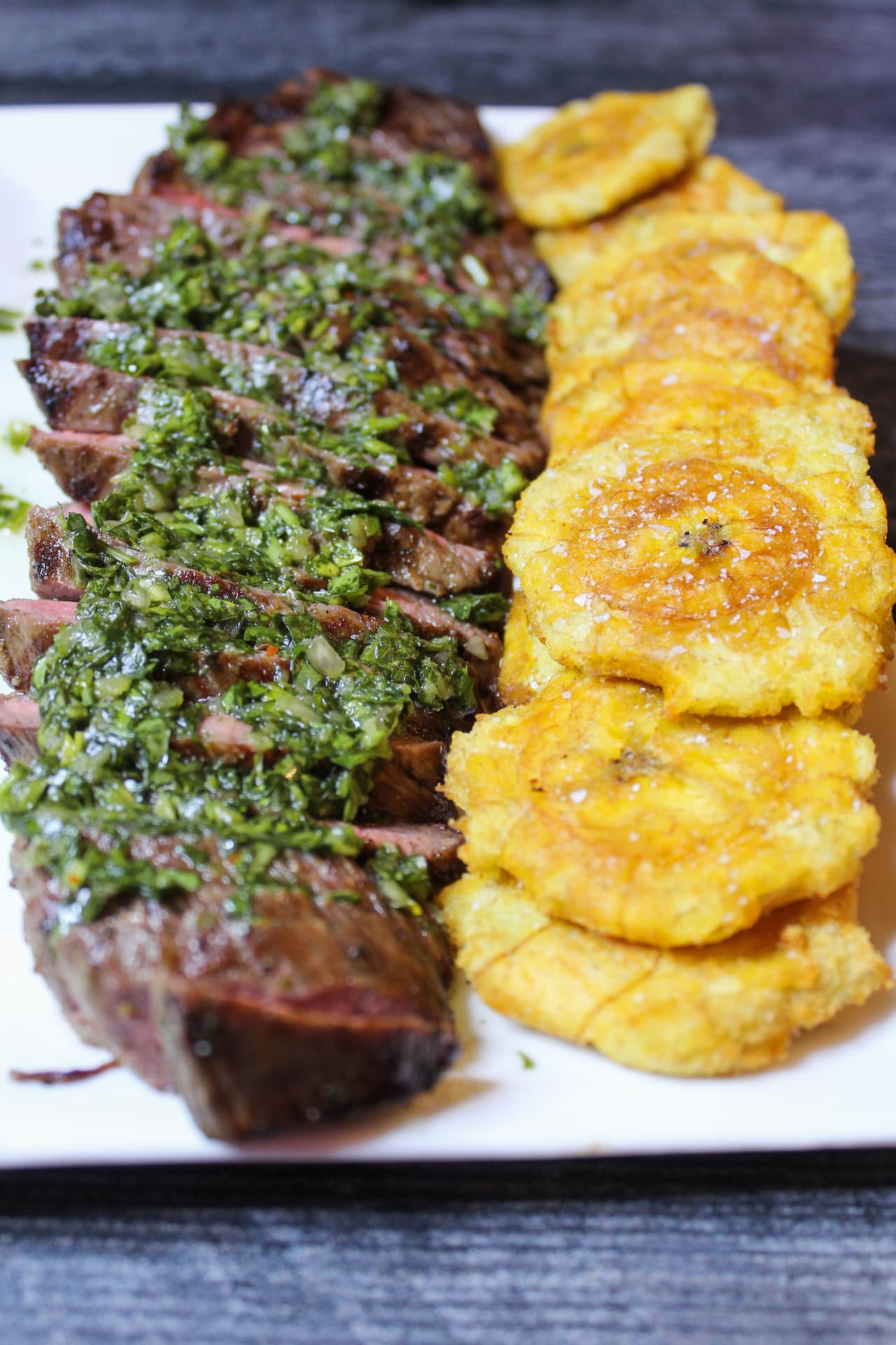 Grilled Flank Steak topped with Chimichurri Served With Fried Plantain