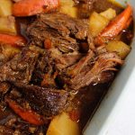 Pot roast with carrots and potatoes in a 9x13 baking dish