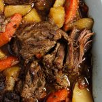 Pot roast with carrots and potatoes in a 9x13 baking dish