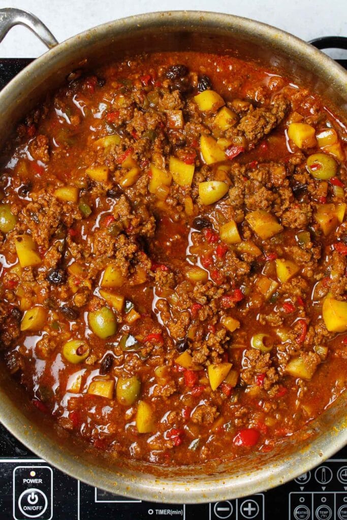 Picadillo in a large skillet.