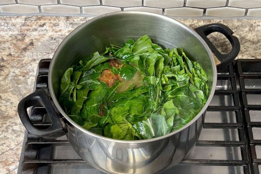 Collard Greens in a large pot with smoked turkey.