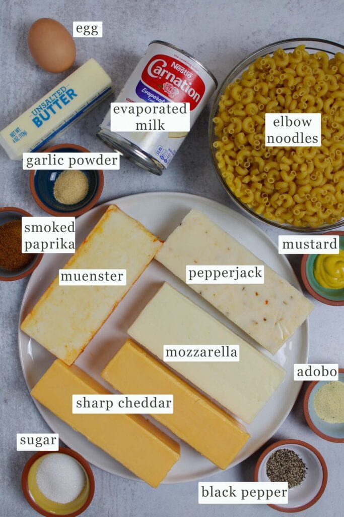 Four cheese baked macaroni and cheese ingredients laid out.