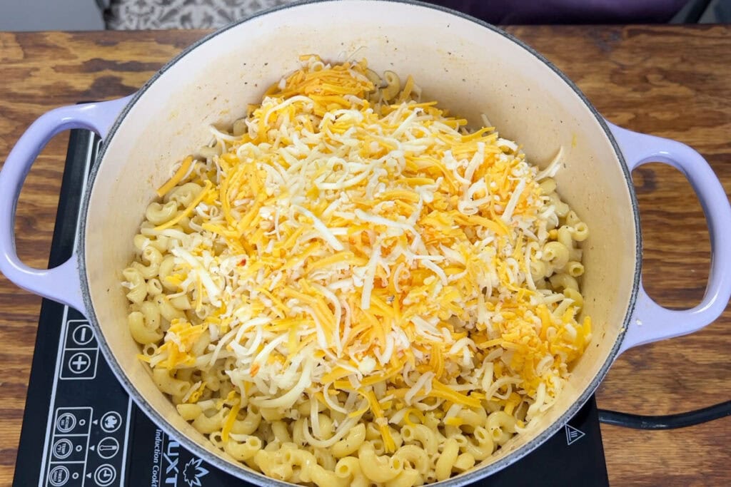 Cheese in a pot of elbow noodles.