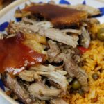 Pernil & arroz con gandules in a bowl.