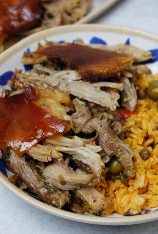 Pernil & arroz con gandules in a bowl.