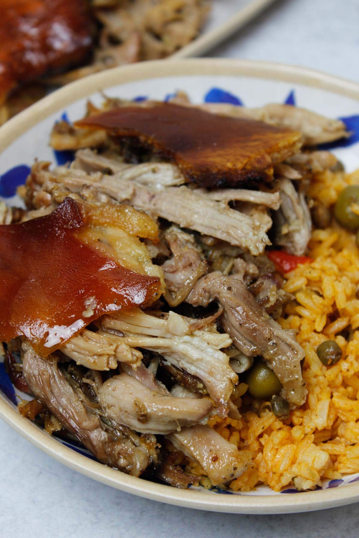 Pernil & arroz con gandules in a bowl.