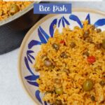 Arroz con gandules in a blue and white plate.