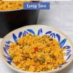 Arroz con gandules in a blue and white plate.