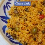 Arroz con gandules in a blue and white plate.