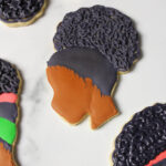 Custom decorated Black Girl Magic sugar cookies.