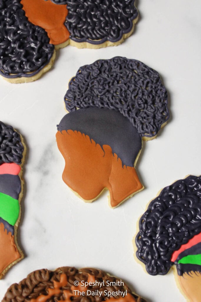 Custom decorated Black Girl Magic sugar cookies.