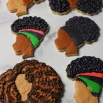 Custom decorated Black Girl Magic sugar cookies.