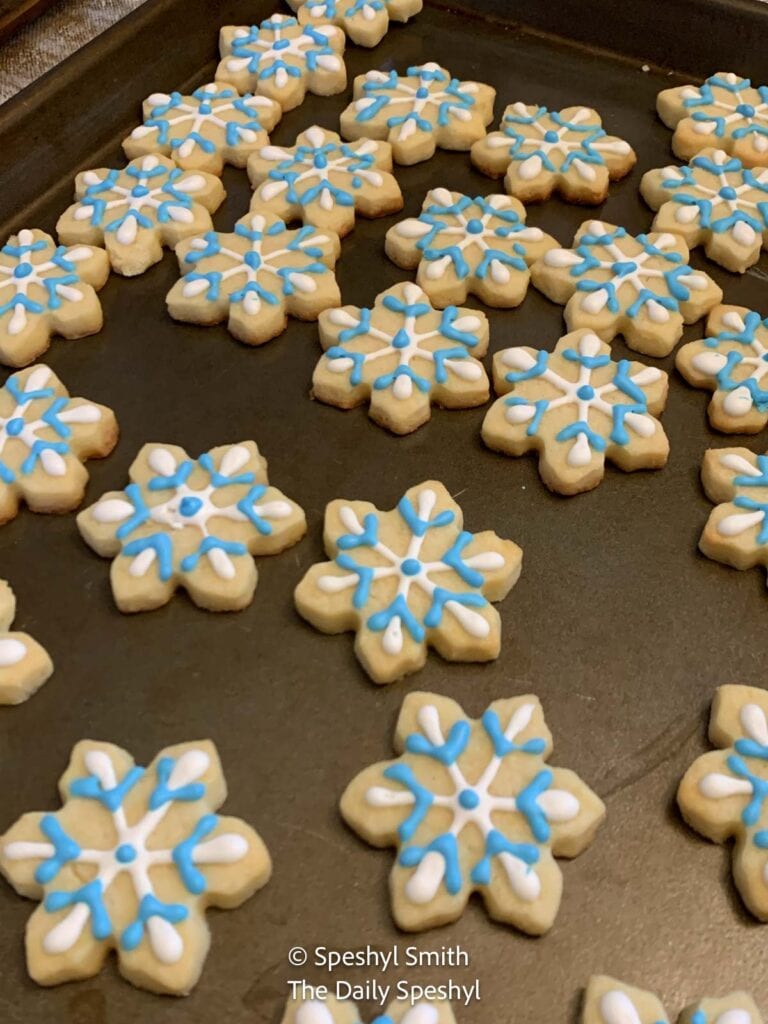 Custom decorated snowflake sugar cookies.