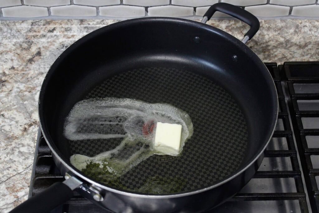 Melting butter in a nonstick skillet.