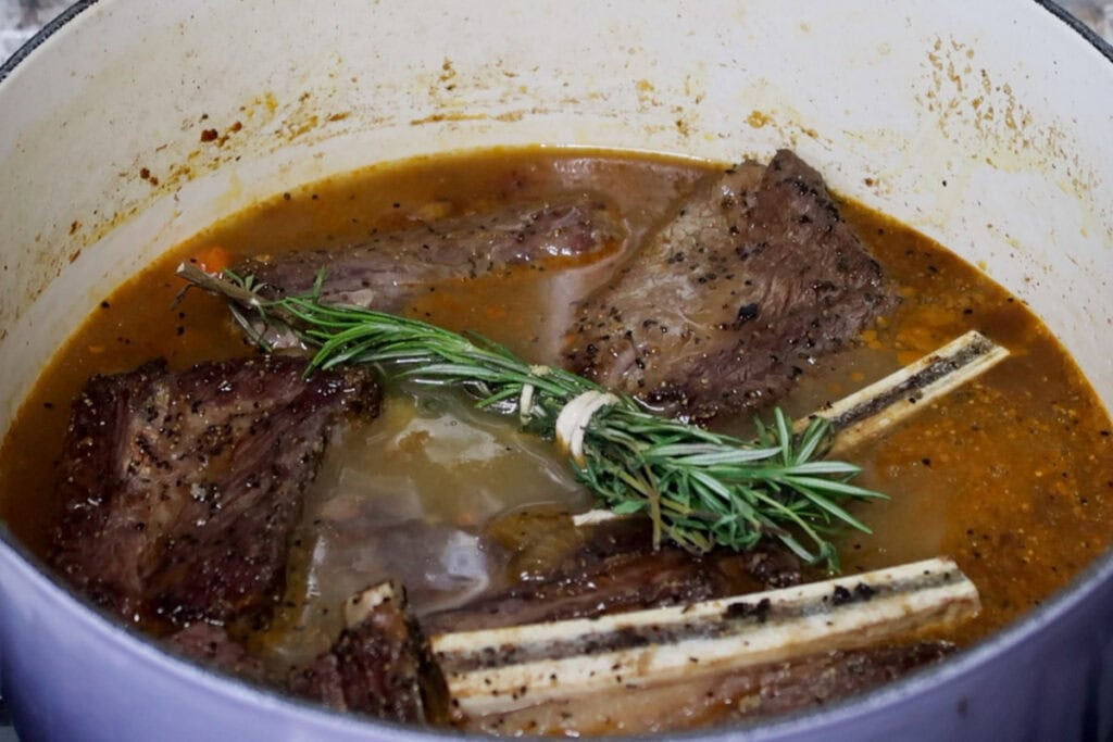 Adding stock to Short Ribs.