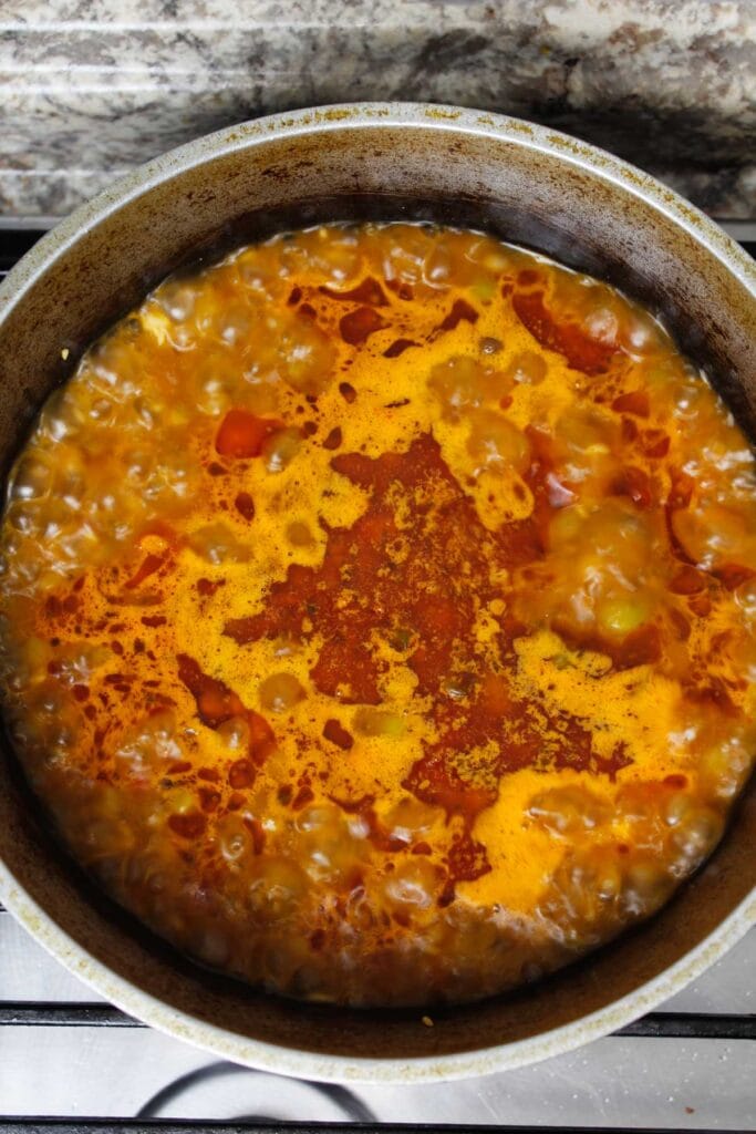 Bringing arroz con gandules to a boil.