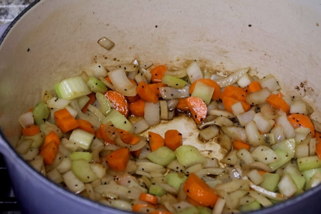 Sweating mirepoix (onions, carrots and celery).