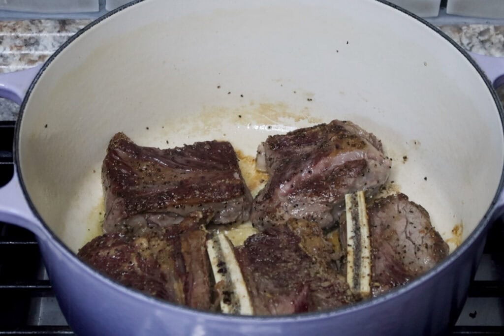 Searing short ribs in dutch oven.